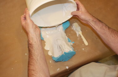 pouring plaster onto a vulva mould